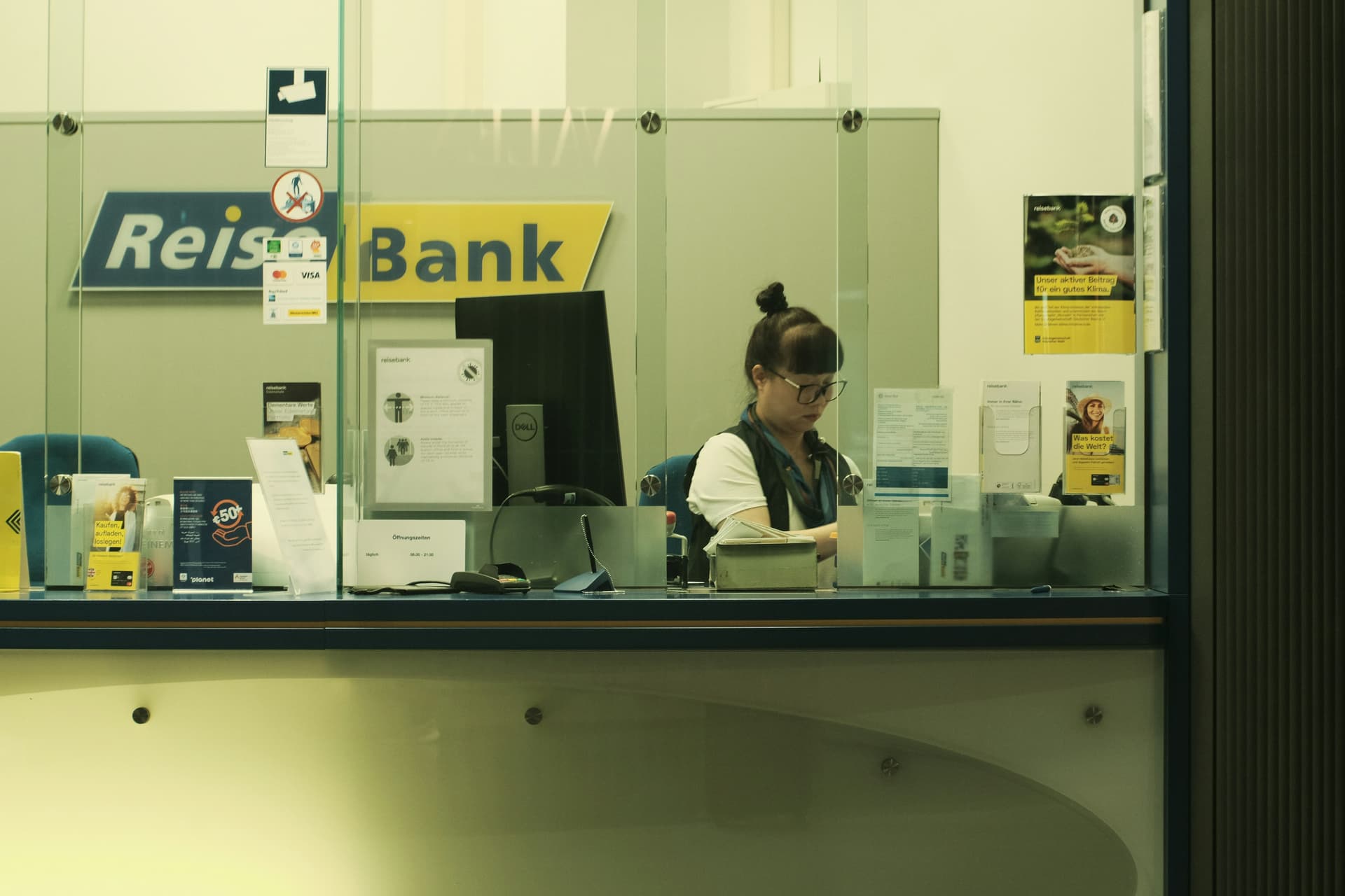 Person at desk reviewing documents — account/citizenship verification