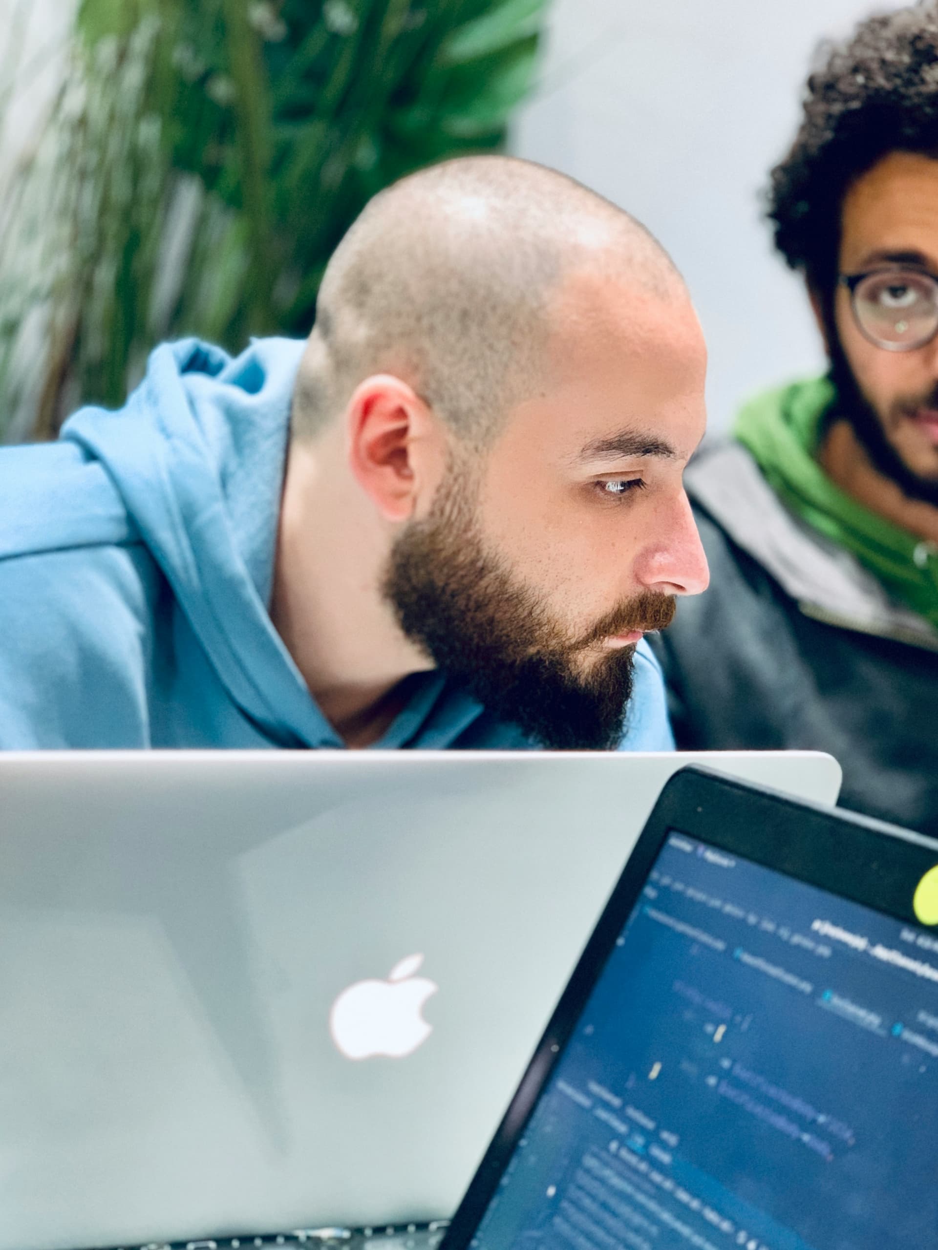 Software developer working on a laptop in an office