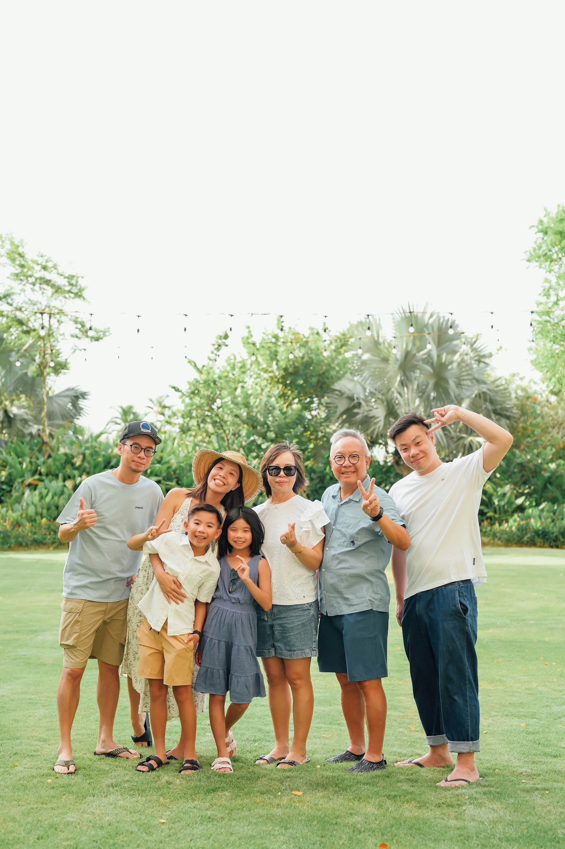 Multi-generational family outdoor group portrait — bringing parents from Korea