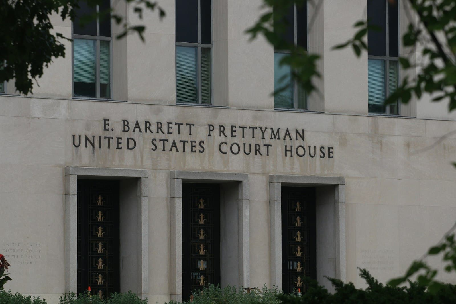 The name of a United States court house carved into the stone facade
