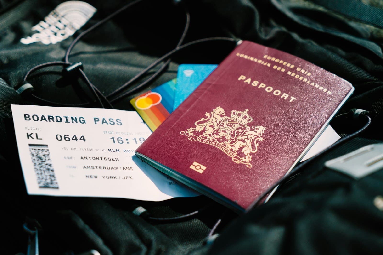A passport and a boarding pass for a flight to New York JFK